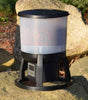 Evolution Aqua EvoFeed Automatic Fish Feeder beside the pond