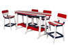 Red White and Blue patriotic Surfboard Table against a white background with 4 matching chairs surrounding it.