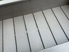 Close-up of the inside of a gray poly planter box with horizontal slats