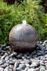 Blue Limestone Sphere adding a great accent to the garden. 