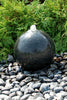 Black Granite Sphere Fountain adding a touch of zen to the landscape.