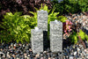 Stone fountains adding style to a garden.