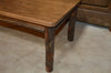 Side view of A&L Furniture Hickory Solid Wood Coffee Table, Walnut Finish