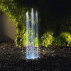 Oase Water Quintet Programmable Illuminated 5-Jet Fountain in a patio garden