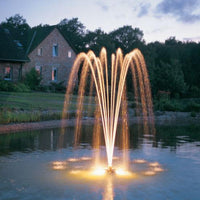 Oase PondJet Floating Fountain illuminating the pond at night