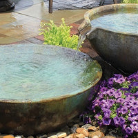 Beautiful cascading patio fountain using Aquascape® Spillway Bowl and Basin Landscape Fountain Kit