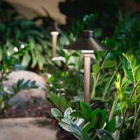 Aquascape® Path and Area LED Hat Top Landscape Lights planted in patio garden