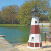 Octagonal Amish-Made Wooden Montauk, NY Replica Lighthouse on the edge of a lake next to a pier