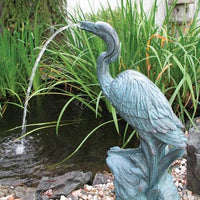 EasyPro Tranquil Décor Bronze Resin Heron Spitter installed in a pond