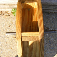 Side view of Amish-Made Decorative Rotating Wooden Water Wheels