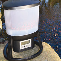 Evolution Aqua EvoFeed Automatic Fish Feeder can be mounted beside pond