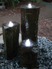 Three basalt columns with EasyPro LED Statuary Light Set installed