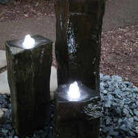Three basalt columns with EasyPro LED Statuary Light Set installed