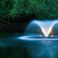 Scott Aerator Two-Light LED Fountain Lighting Set illuminating a lake fountain