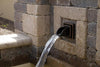 Atlantic Water Gardens Oil-Rubbed Bronze Finish Mantova Wall Spout installed in patio fountain