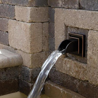 Atlantic Water Gardens Oil-Rubbed Bronze Finish Mantova Wall Spout installed in patio fountain
