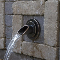 Atlantic Water Gardens Oil-Rubbed Bronze Finish Ravenna Wall Spout installed in patio fountain
